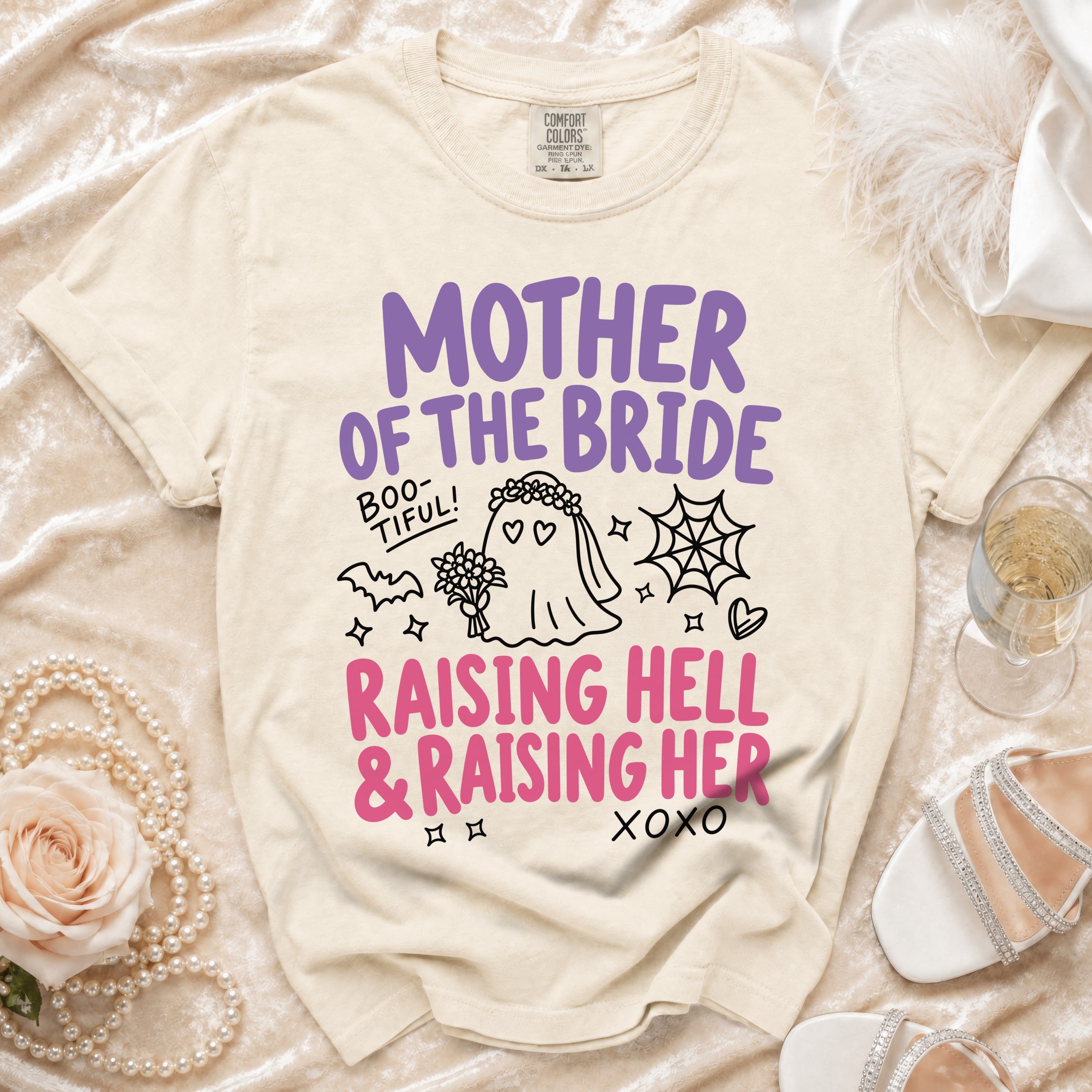 "Mother of the Bride" t-shirt with ghost bride graphic and pink text.