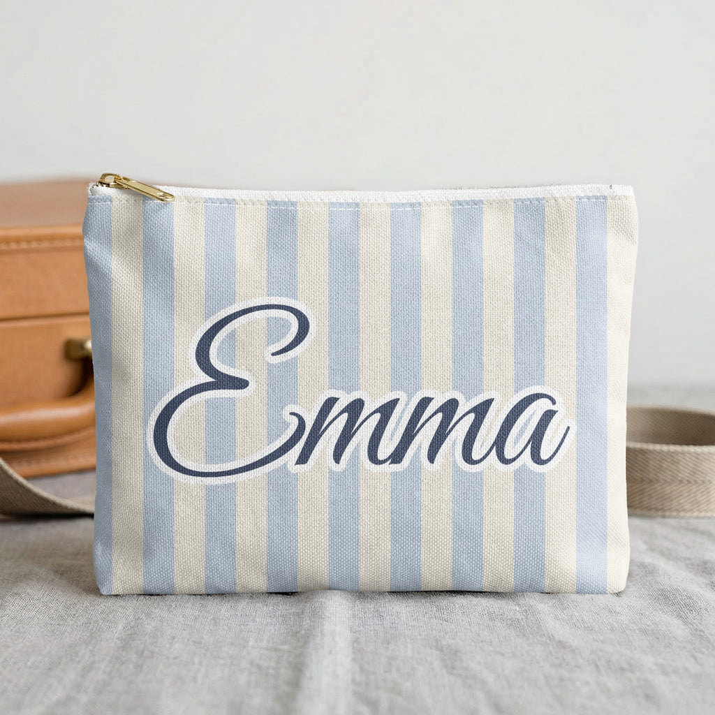 Chambray Last Toast On The Coast name pouch in front of a travel case