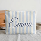 Chambray Last Toast On The Coast name pouch in front of a travel case