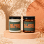 Two glass candles with "May Contain Wedding Stress" text on their labels.