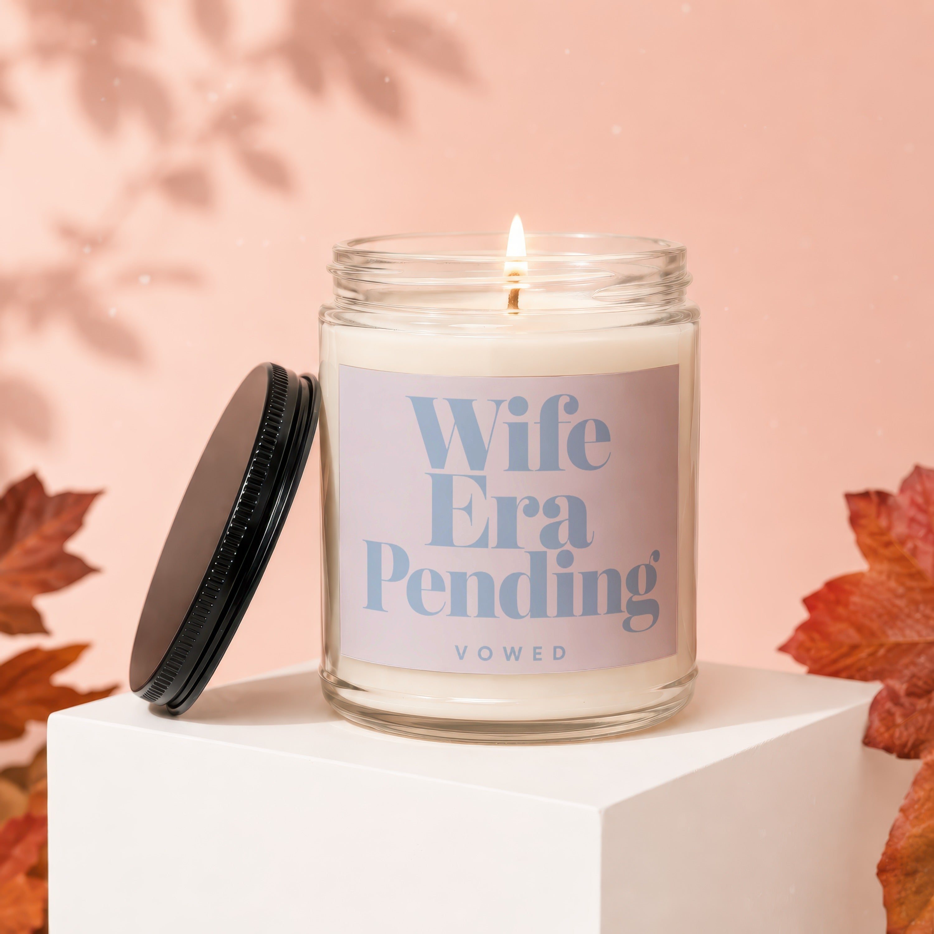 Candle with "Wife Era Pending" and "Vowed" on a light pink background.