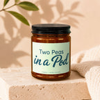 Two Peas in a Pod candle in amber glass jar with black lid; VOWED | HAND POURED