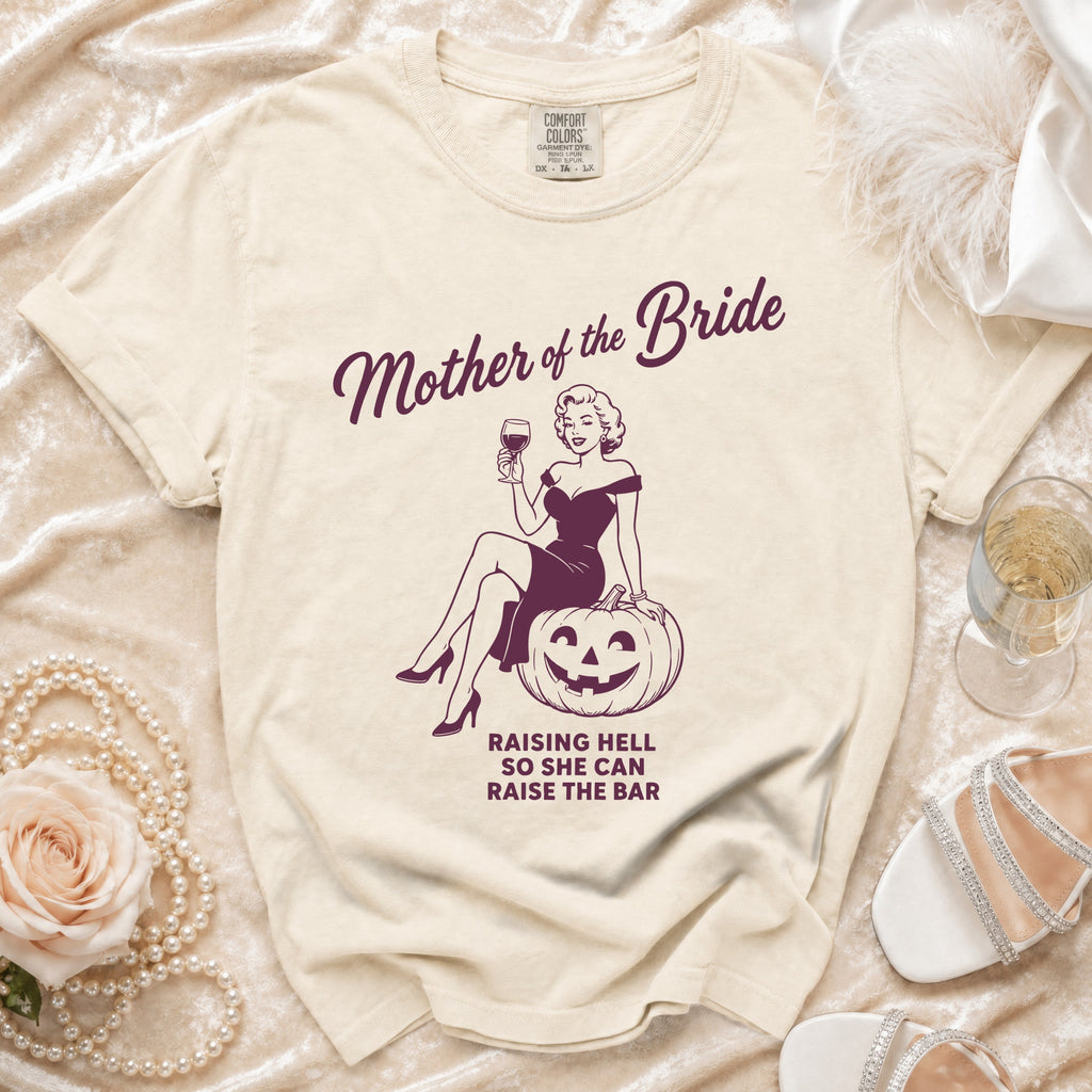 Cream t-shirt with "Mother of the Bride" graphic and text.