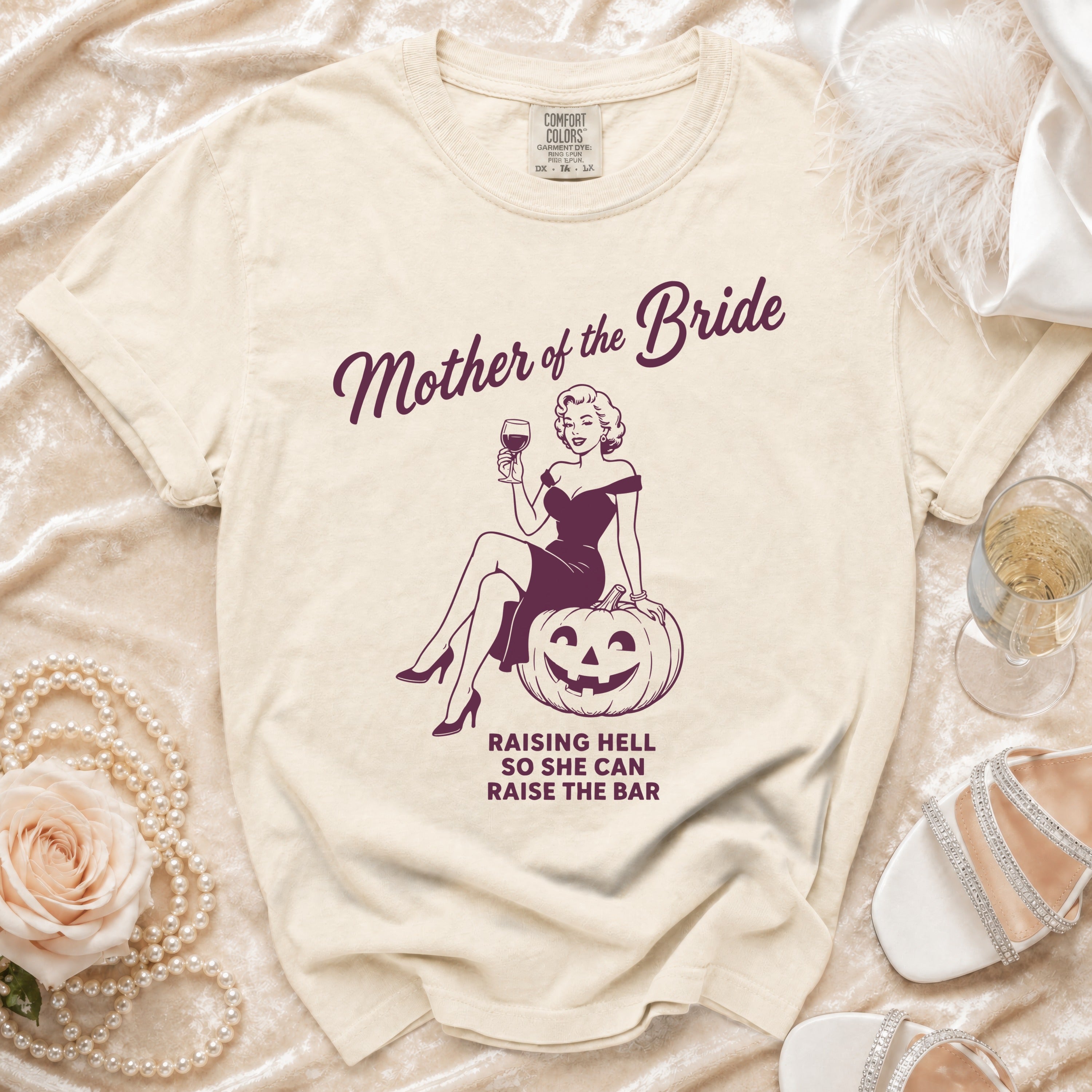 Cream t-shirt with "Mother of the Bride" graphic and text.