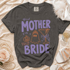 Dark gray t-shirt with "Official Mother of the Bride" text and graphics.
