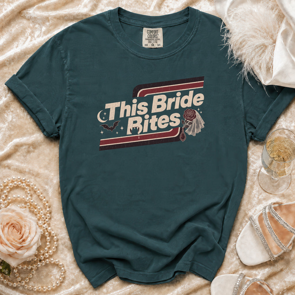 Teal t-shirt with "This Bride Bites" graphic, bats, and vampire fangs.