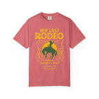 Pink t-shirt with "Her Last Rodeo" text, cowboy, and lasso graphic.