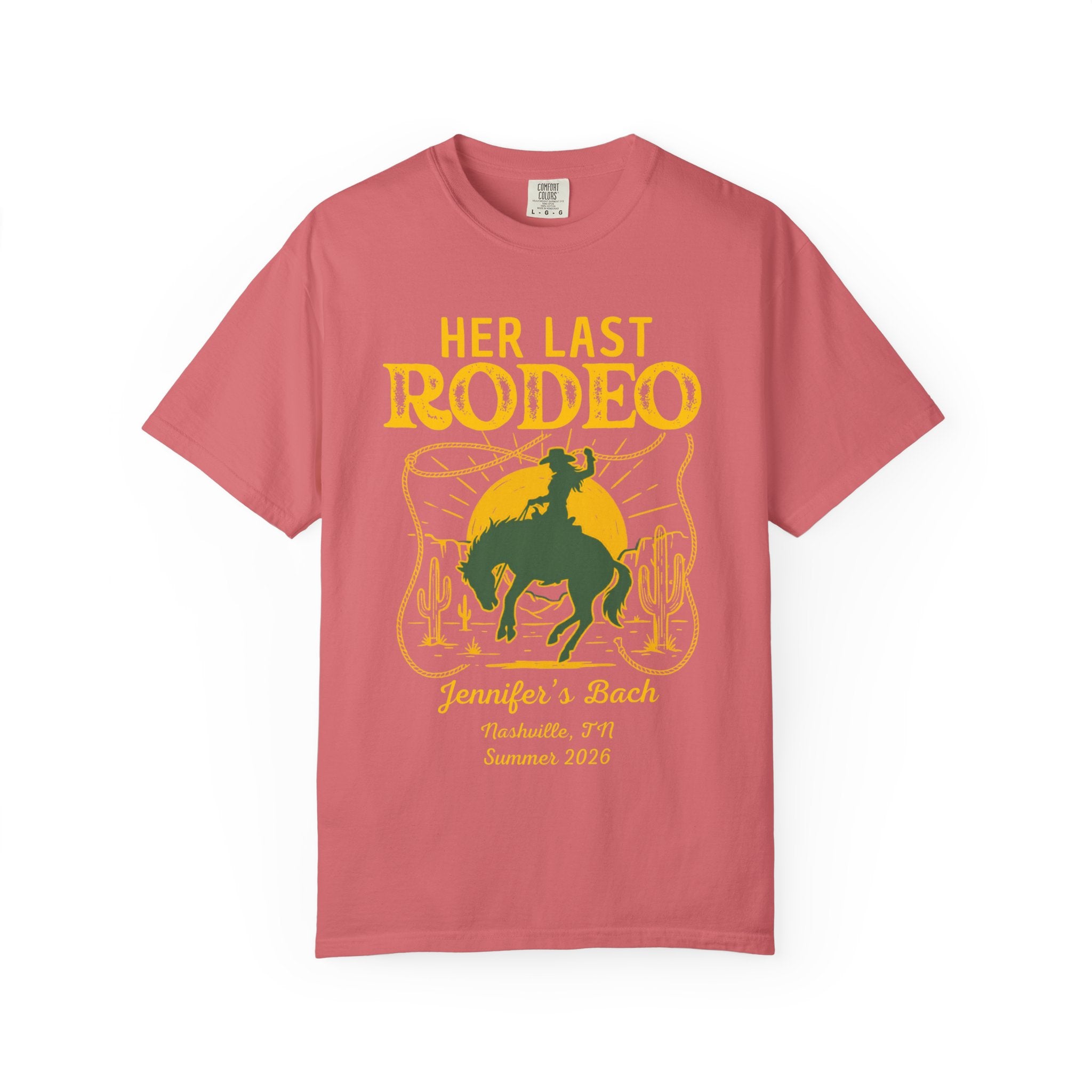 Pink t-shirt with "Her Last Rodeo" text, cowboy, and lasso graphic.