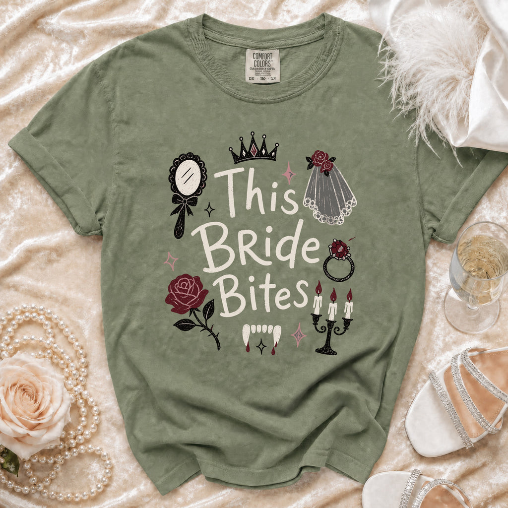 Green t-shirt with "This Bride Bites" vampire-themed graphic, ring, and rose.
