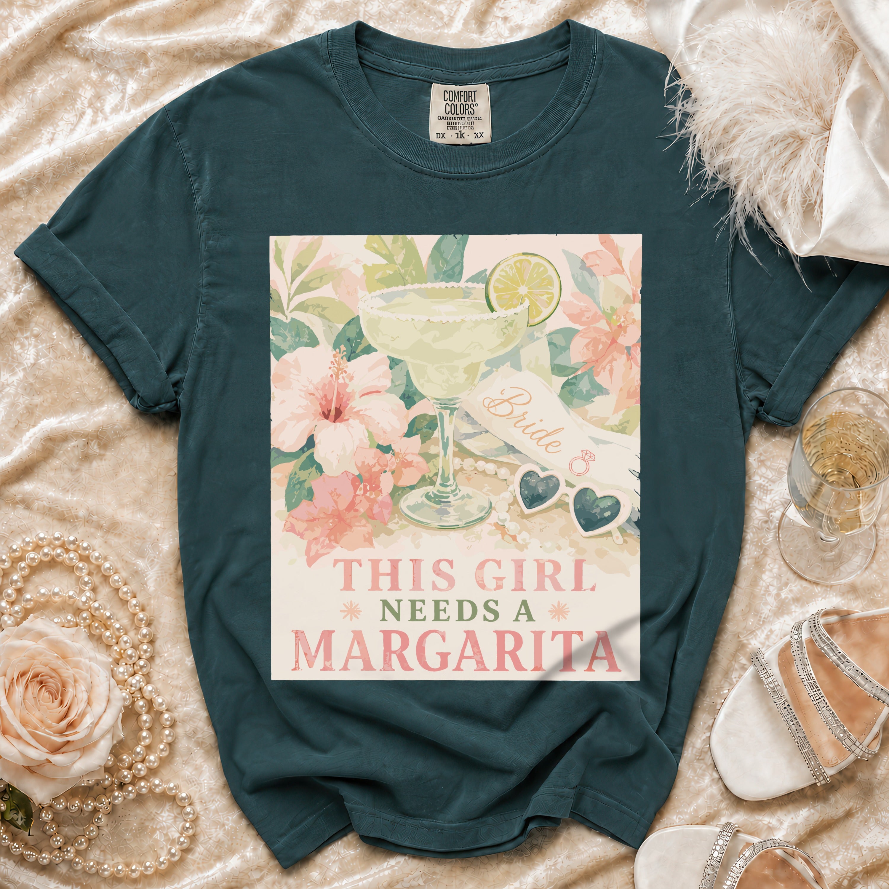 Teal t-shirt with design "This girl needs a margarita" and floral margarita.