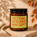 Amber candle with a label reading "Getting Hitched and Sh*t" by Vowed.