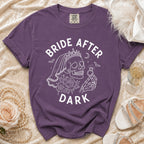 Purple t-shirt with "BRIDE AFTER DARK" text and skull graphic.