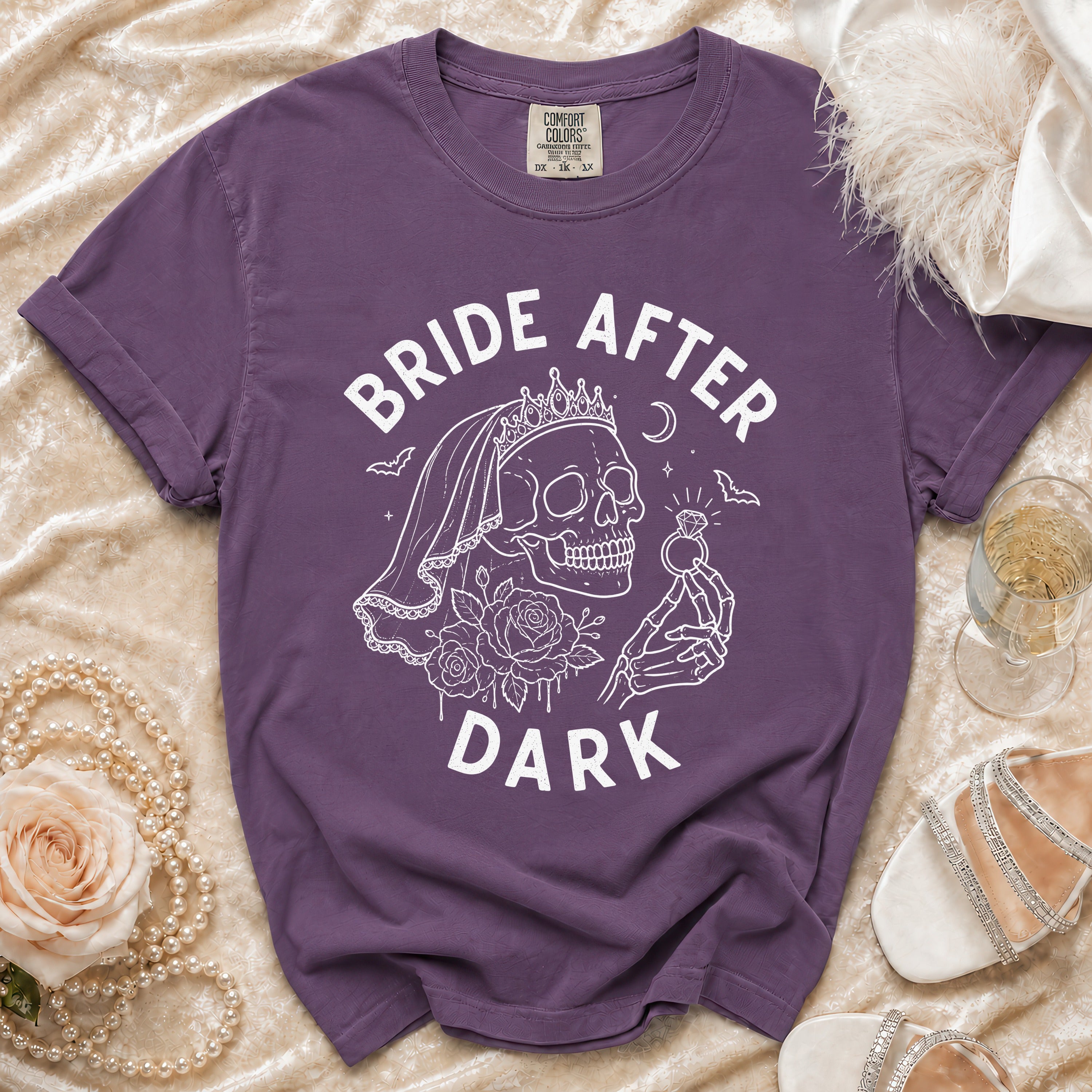 Purple t-shirt with "BRIDE AFTER DARK" text and skull graphic.