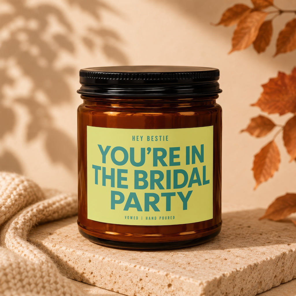 Amber candle with "You're In The Bridal Party" text on a light green label.
