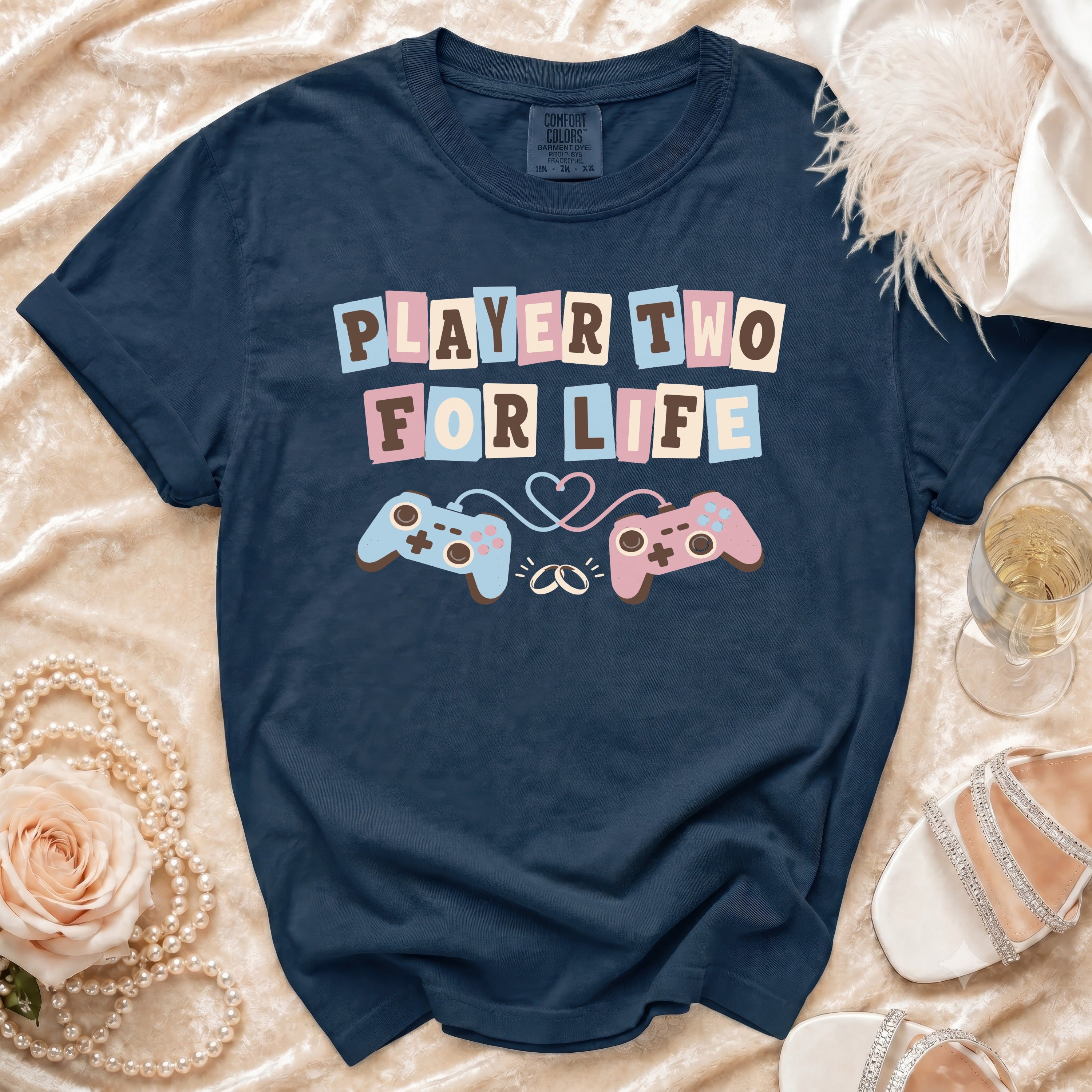 Navy t-shirt with "PLAYER TWO FOR LIFE" text and gaming controllers.