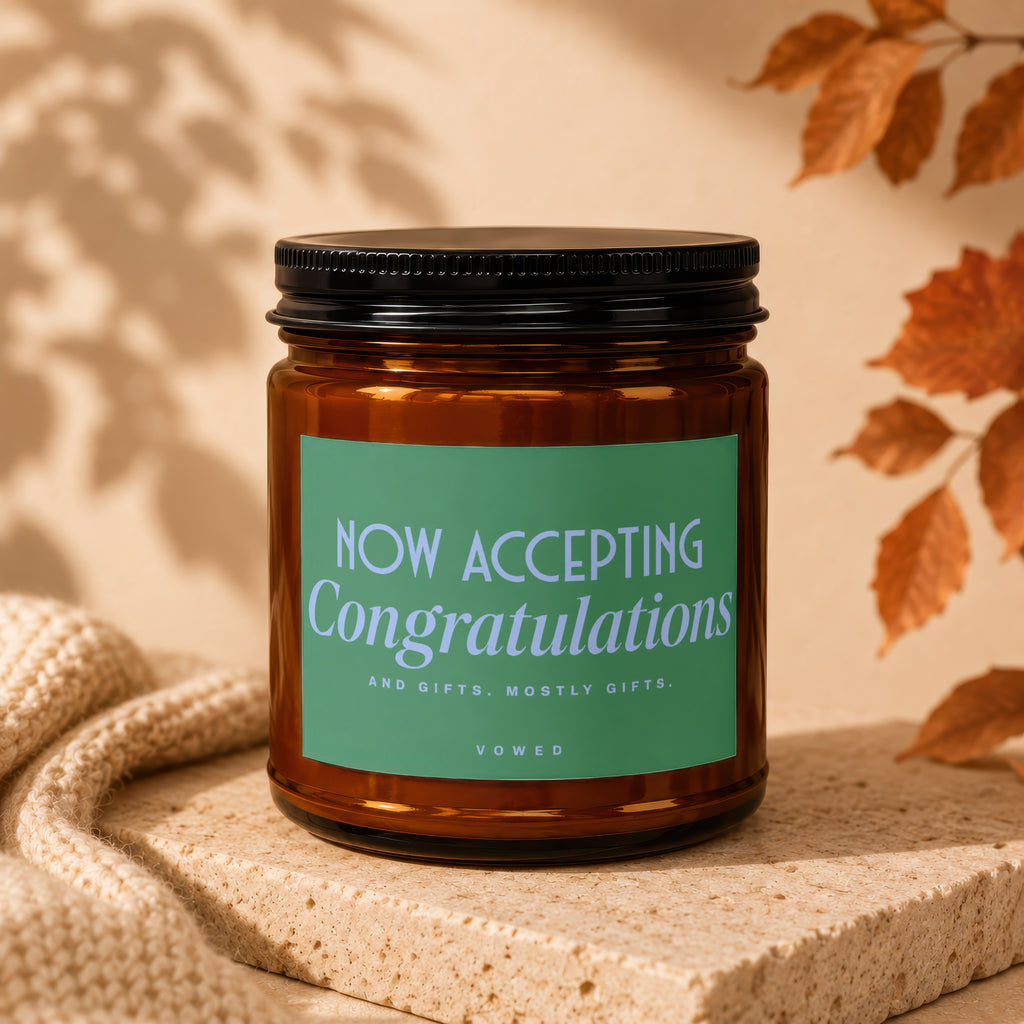 Amber candle with "NOW ACCEPTING Congratulations" on a green label.