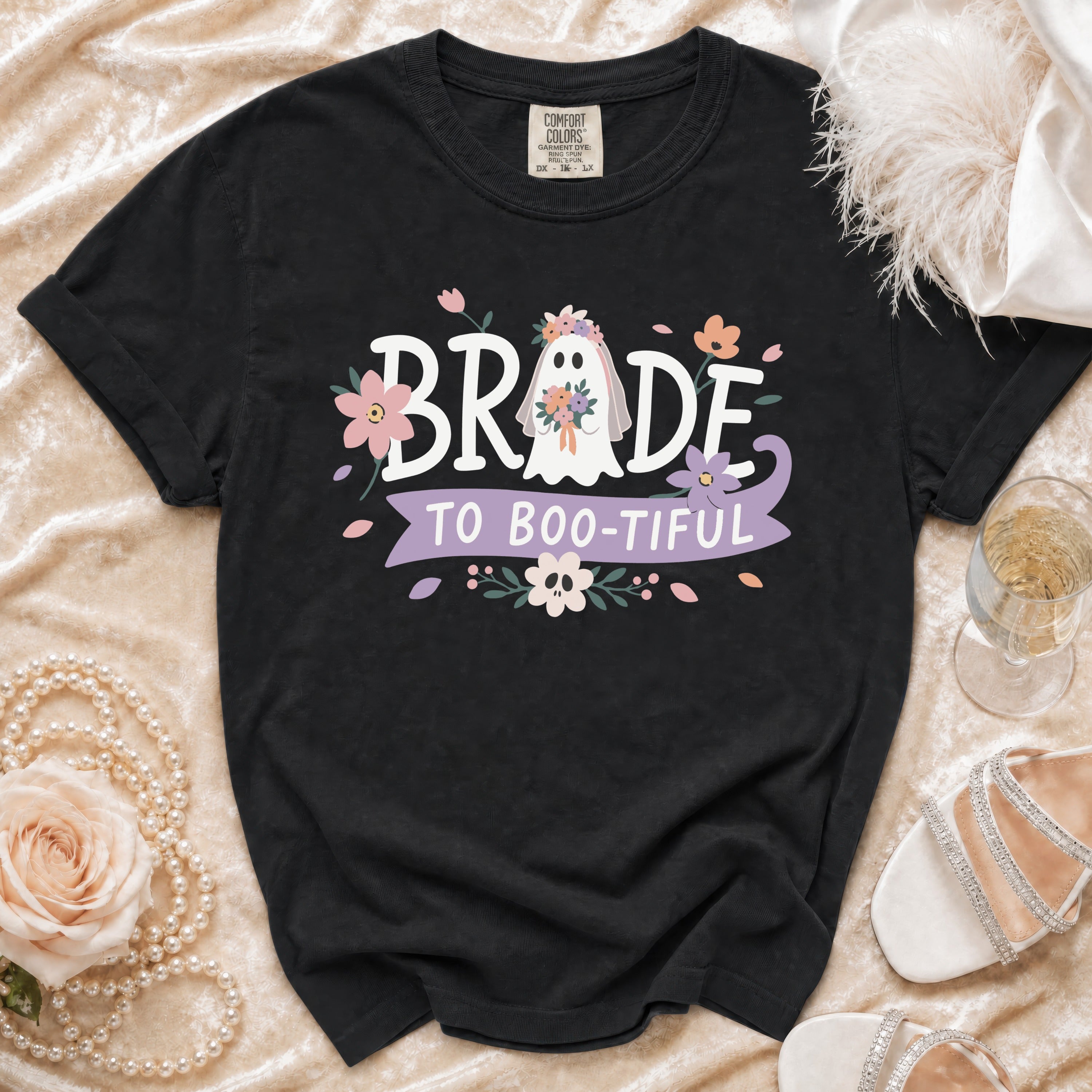 Black t-shirt with "Bride to Boo-tiful" text and a floral ghost graphic.