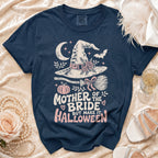 Navy t-shirt with "Mother of the Bride, But Make It Halloween" text and witch hat graphic.