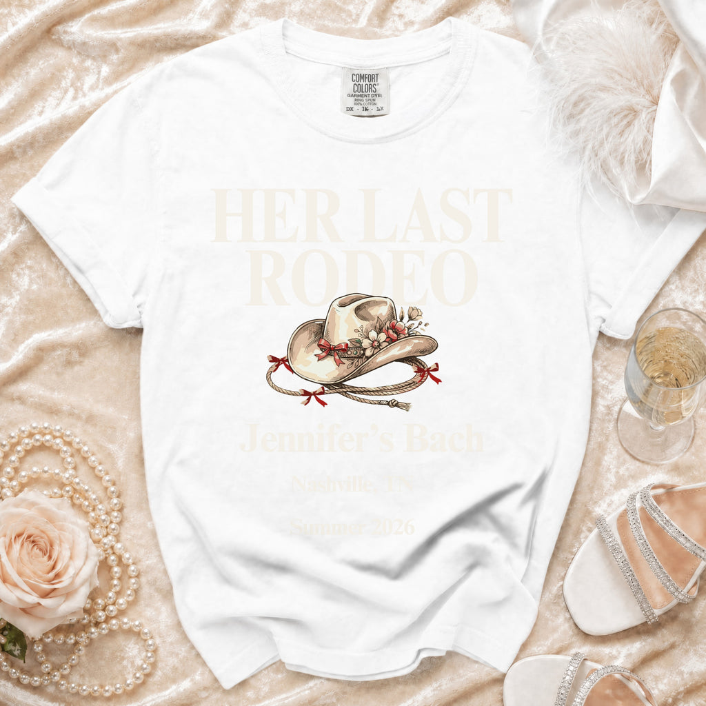 White t-shirt with "HER LAST RODEO" and "Jennifer's Bach" text.