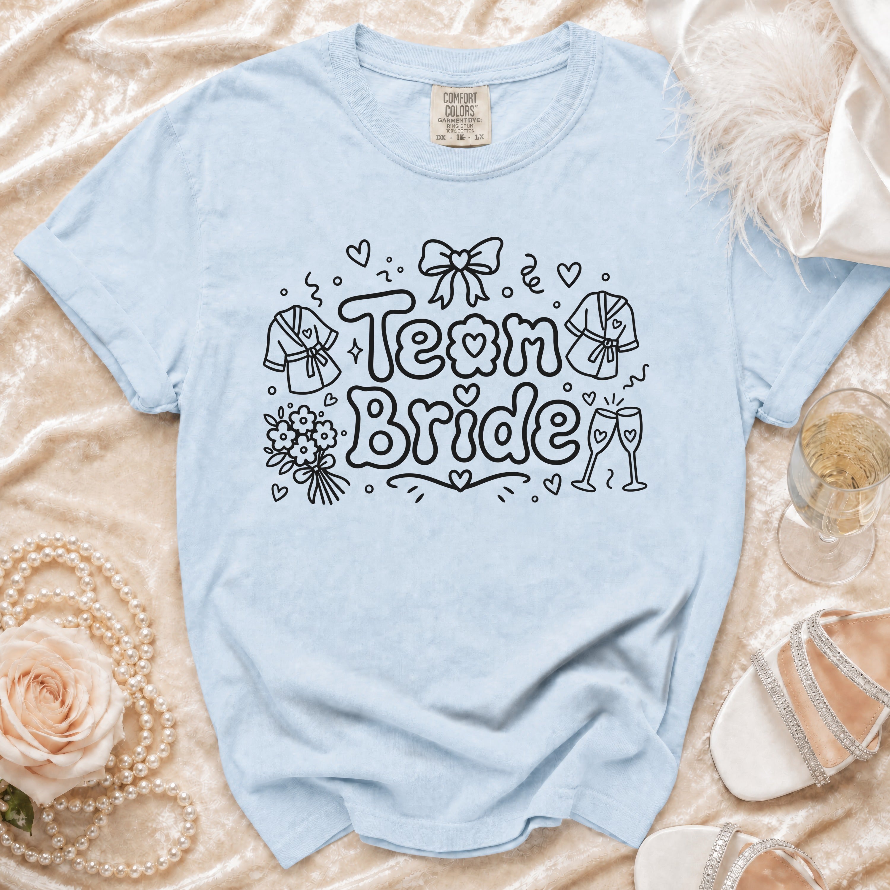 Light blue t-shirt with "Team Bride" and bridal graphics.