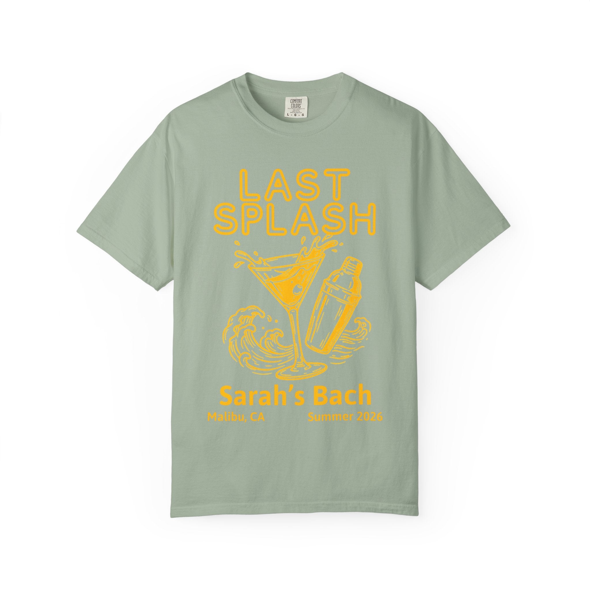 Sage green t-shirt with "LAST SPLASH" in orange, martini glass, shaker, and waves.