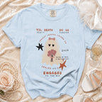 Light blue t-shirt with ghost bride graphic and "Engaged To The Boo" text.