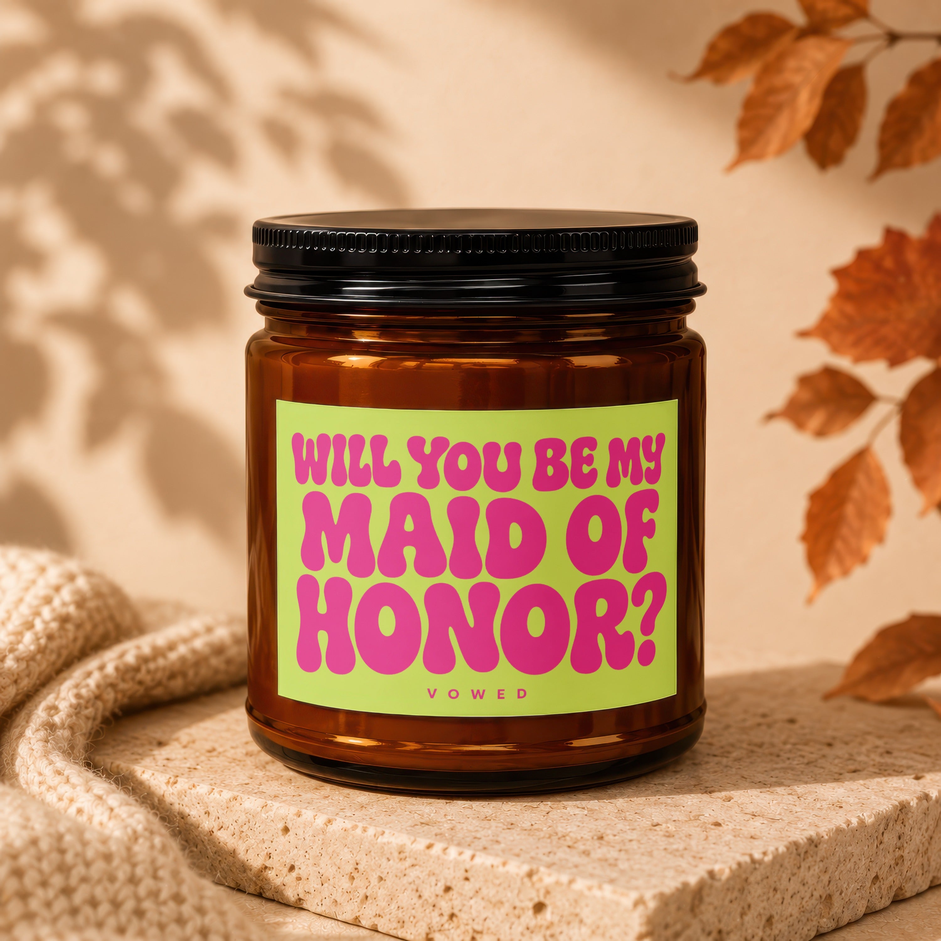 Amber jar candle with green label asking "WILL YOU BE MY MAID OF HONOR?".