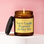 Candle with lit wick and text "NOTICE: You're Legally Required to Say Yes"