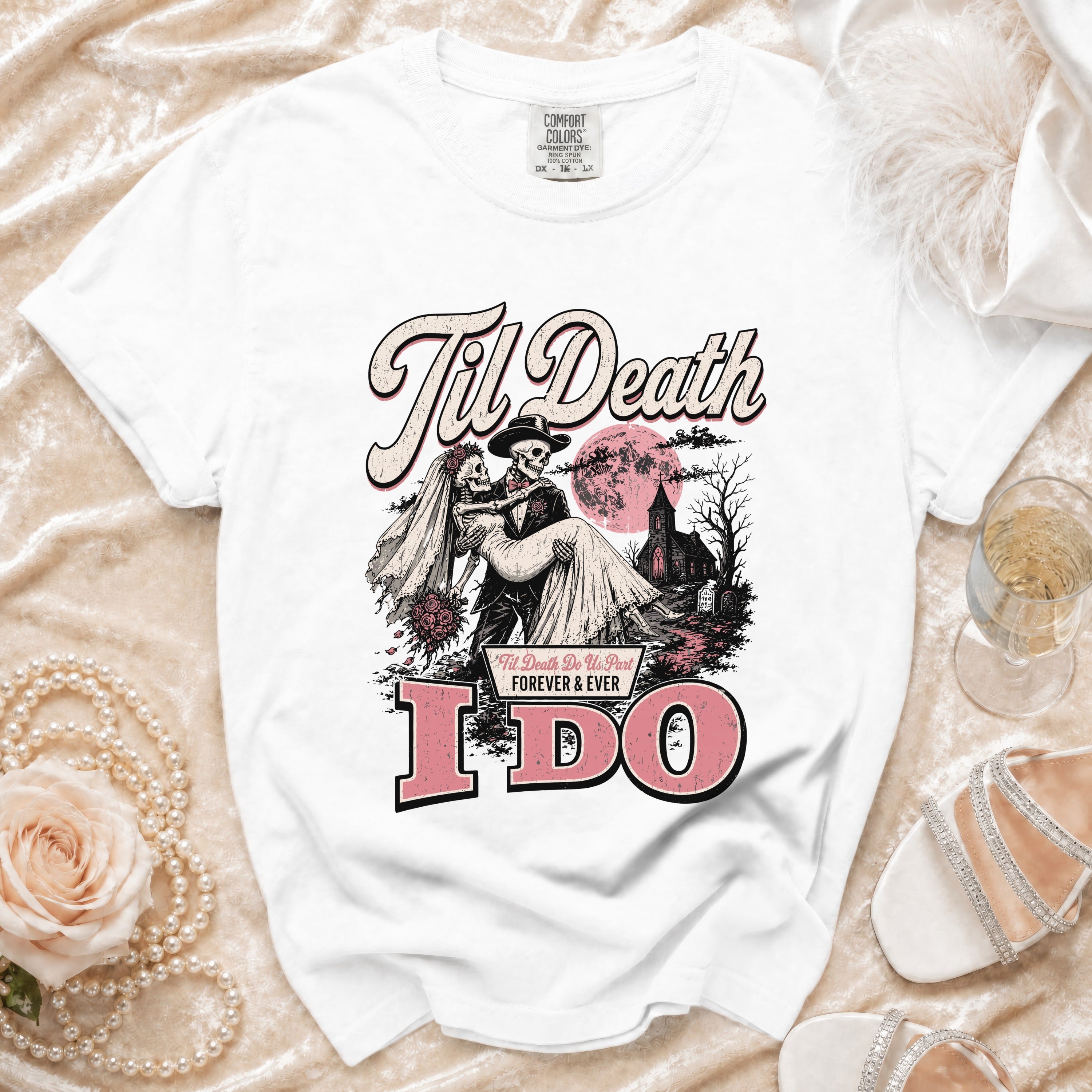 White t-shirt with skeleton bride and groom graphic and "Til Death" and "I DO" text.