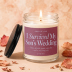 Candle with "I Survived My Son's Wedding" text and burning wick.
