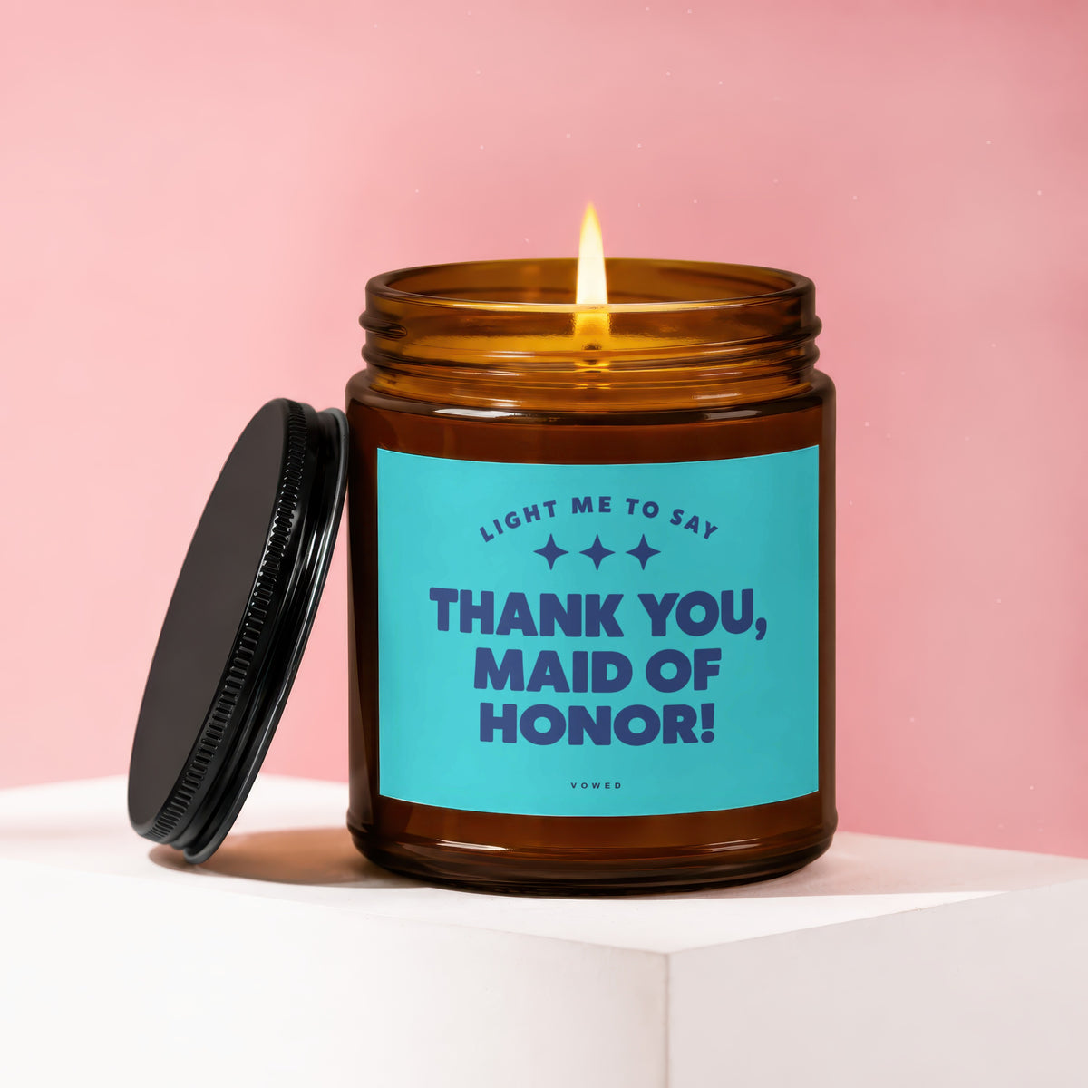 Amber jar candle with lid off, lit flame, and "Thank You, Maid of Honor!" text.