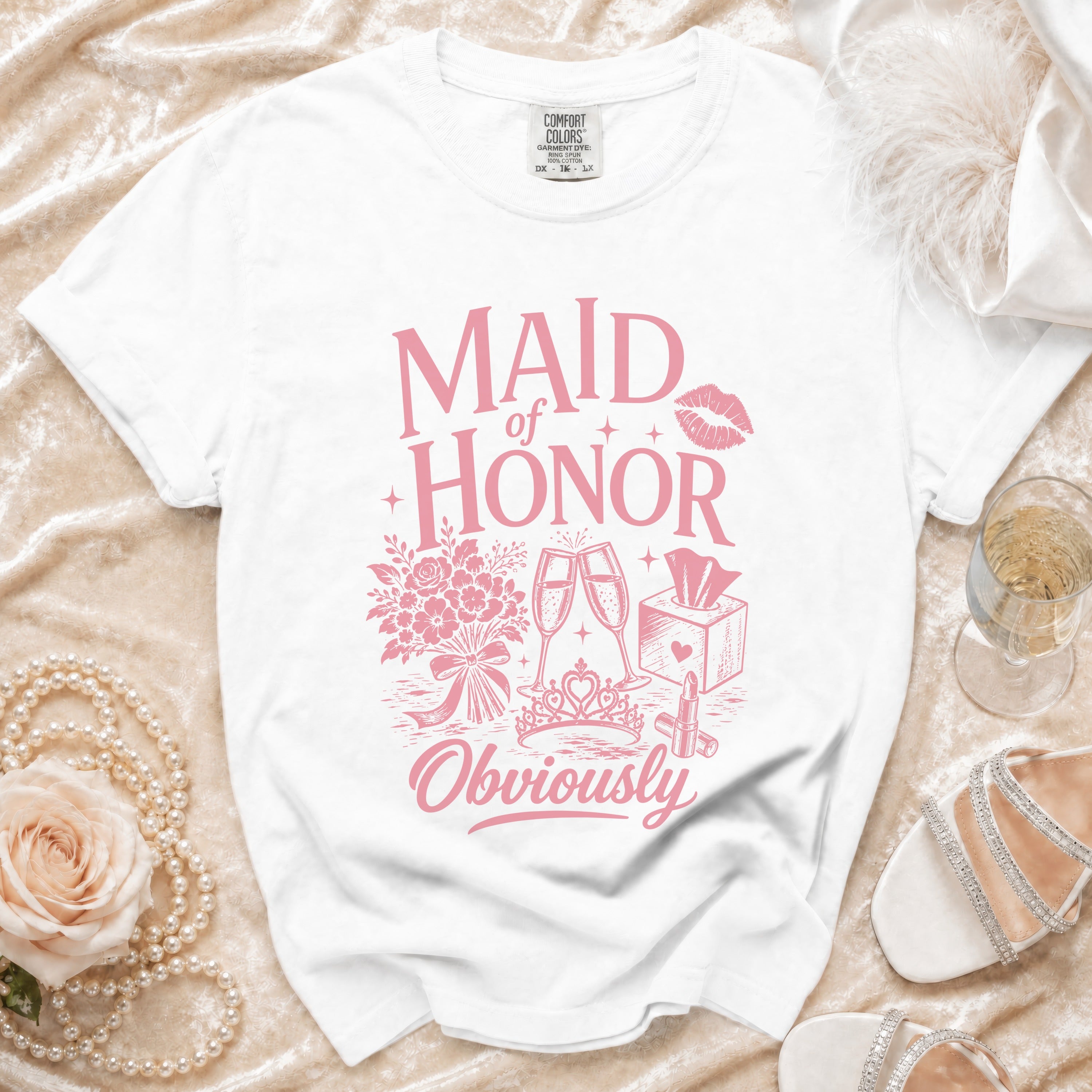 White t-shirt with pink "Maid of Honor Obviously" graphic and icons.