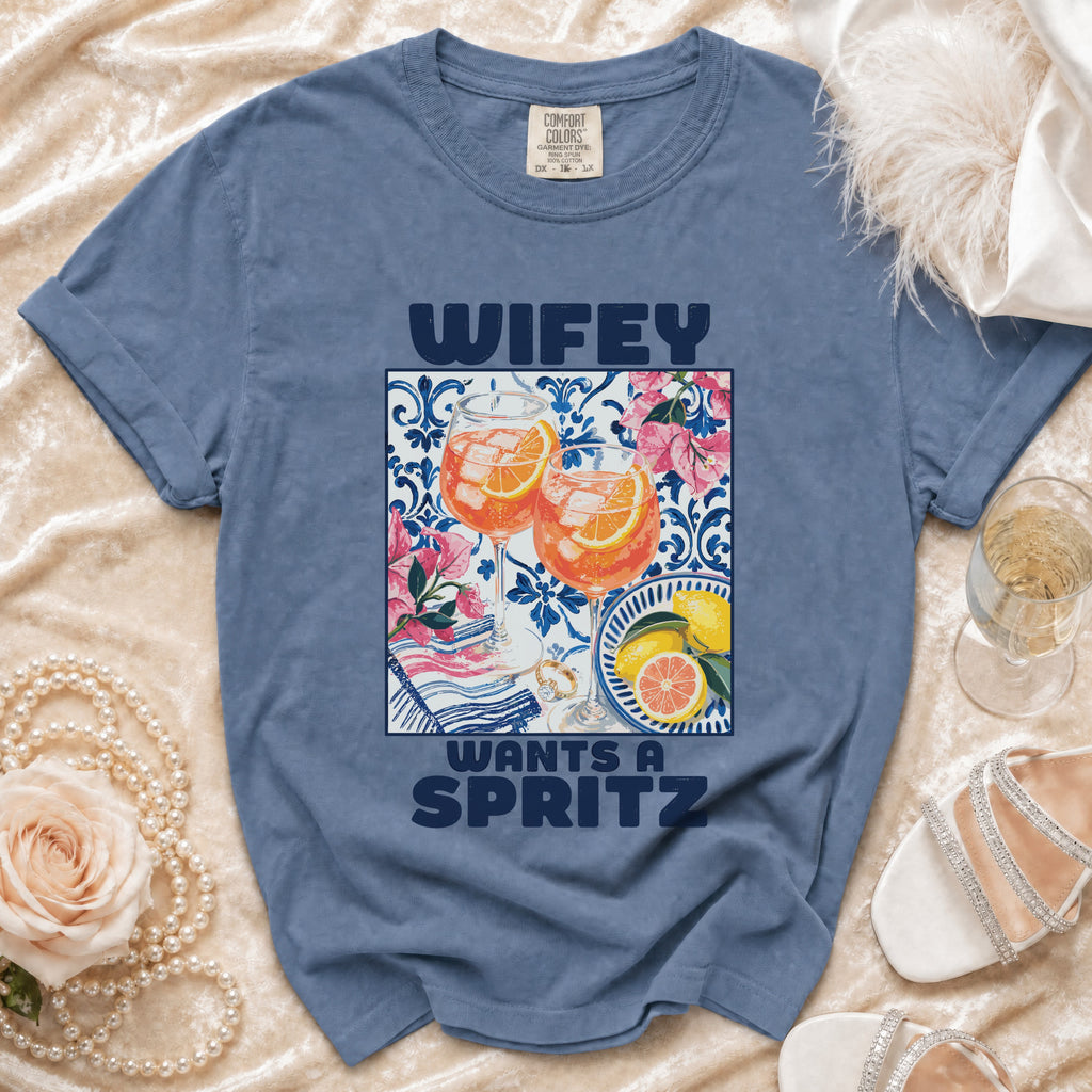Blue t-shirt with "Wifey Wants a Spritz" graphic and cocktail drinks.