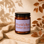 Amber jar candle with lavender label reading "Smells Like World's Best Mother-in-Law".