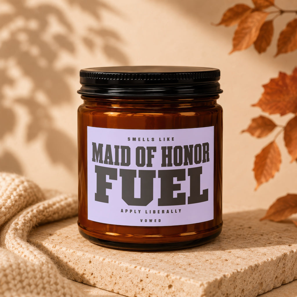 Brown glass candle with lavender label reading "Maid of Honor Fuel" and "Vowed".