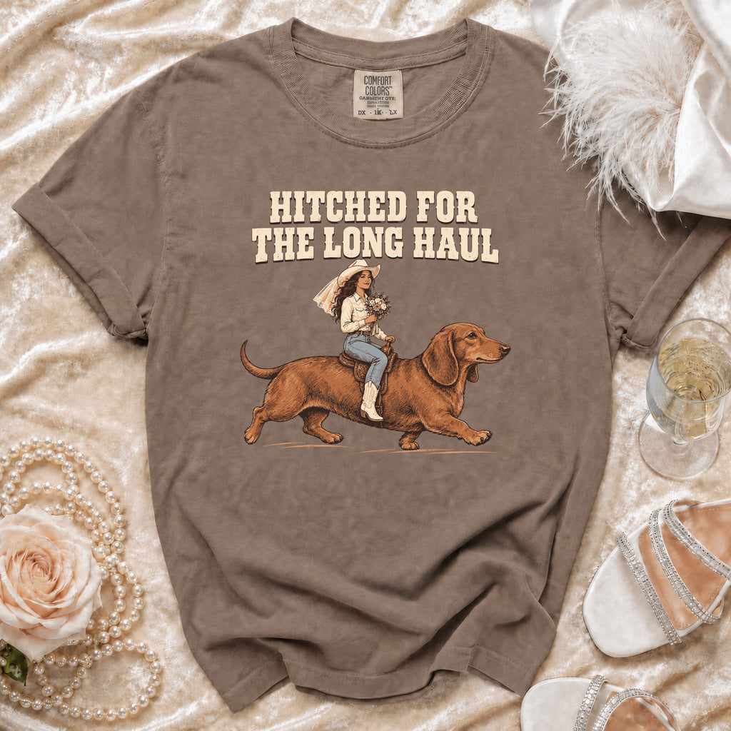 Brown t-shirt with "HITCHED FOR THE LONG HAUL" and a bride on a dachshund.