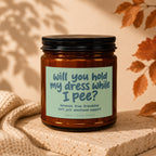 Candle with text: "Will you hold my dress while I pee? because true friendship isn't just emotional support."