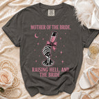 Dark grey t-shirt with "Mother of the Bride, Raising Hell, and The Bride." text.