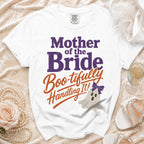 White t-shirt with "Mother of the Bride Boo-tifully Handling It!" text and ghost.