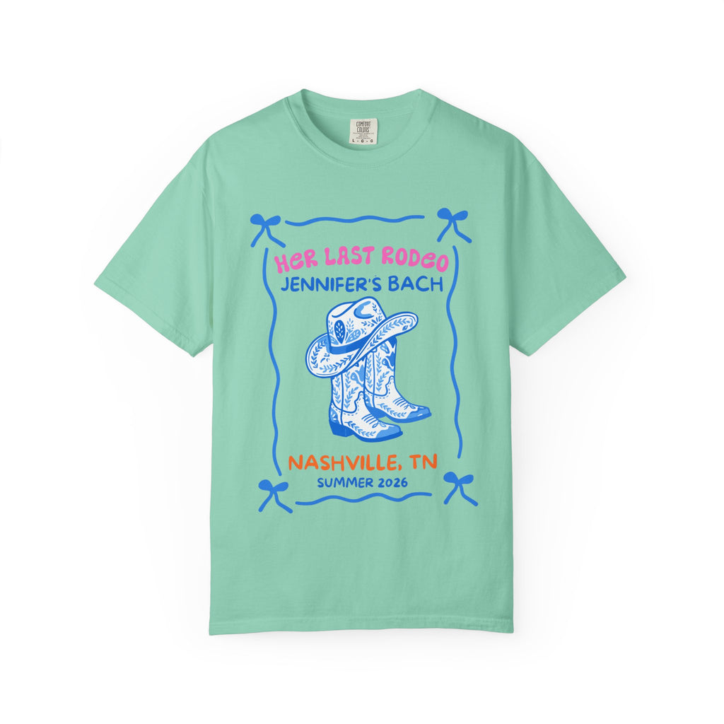 Mint green t-shirt with "Her Last Rodeo Jennifer's Bach Nashville, TN Summer 2026" and cowboy boots.