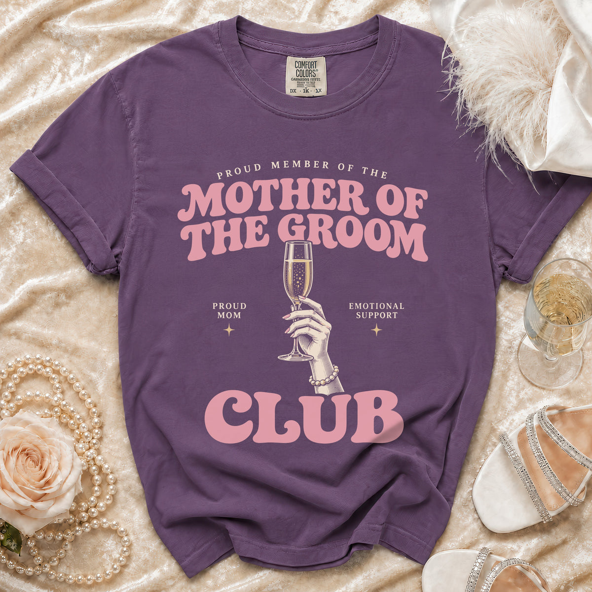 Purple t-shirt with "Proud Member of the Mother of the Groom Club" text and champagne flute.
