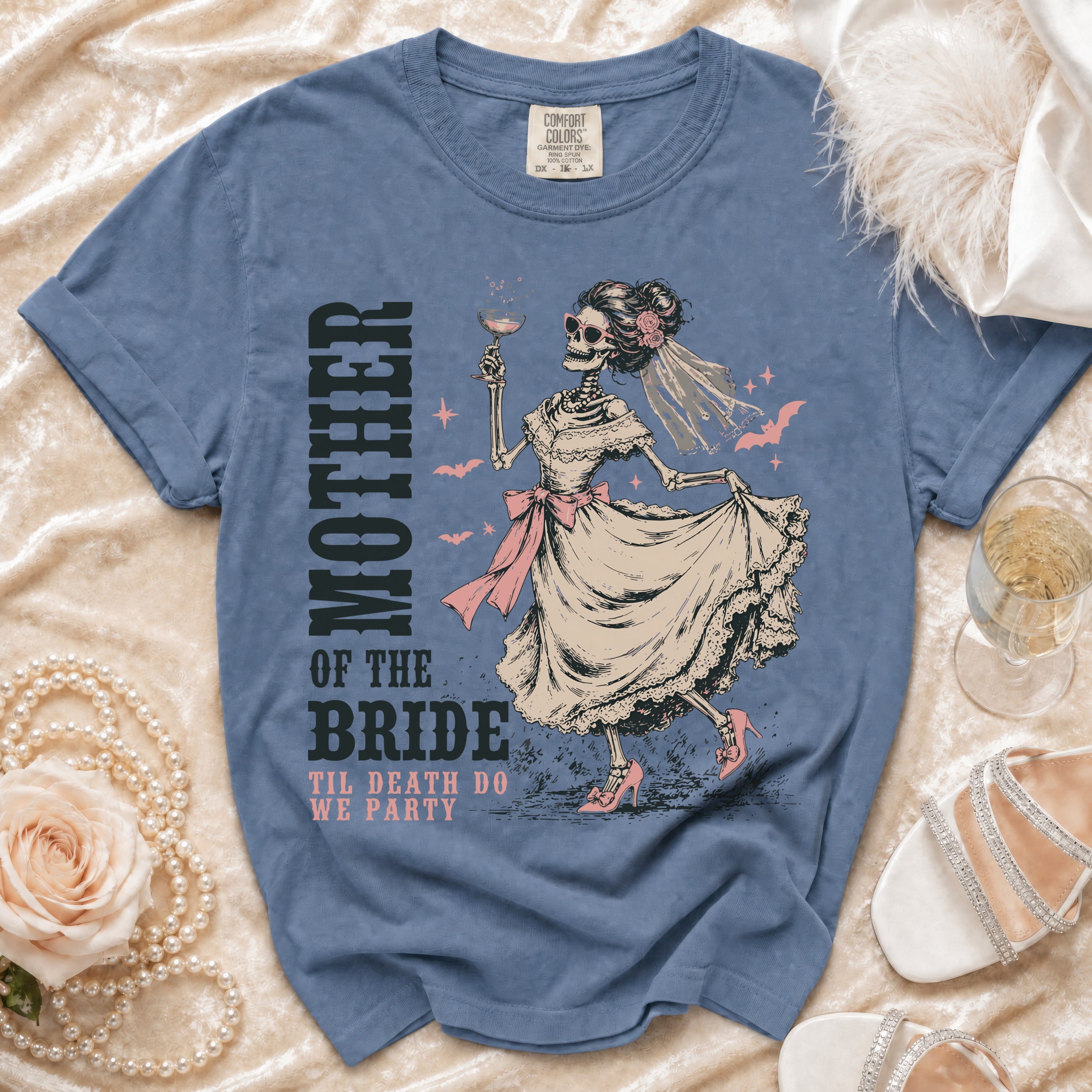 Blue t-shirt with a skeleton bride graphic and text "MOTHER OF THE BRIDE TIL DEATH DO WE PARTY".
