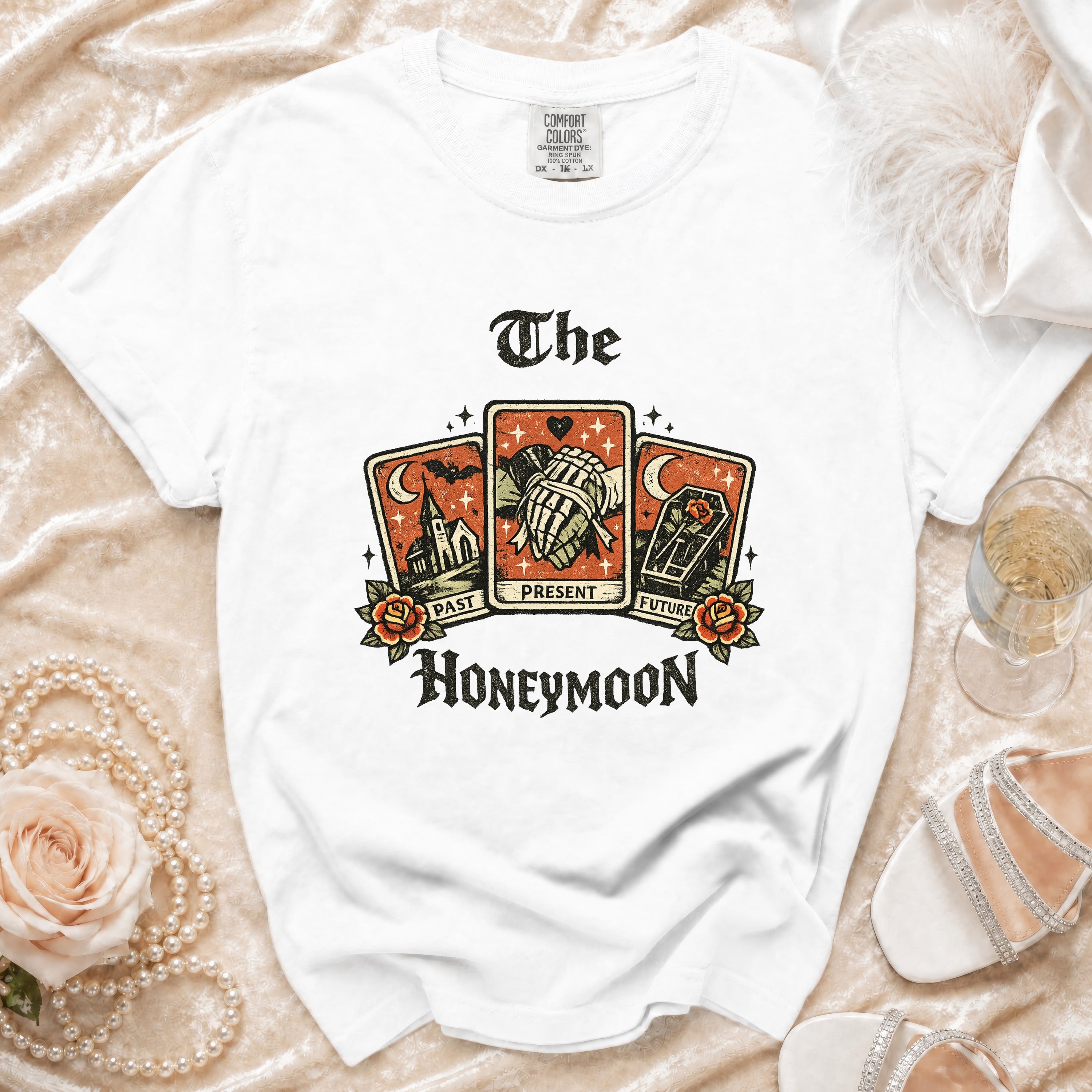 White t-shirt with "The Honeymoon" tarot card graphic including past, present, and future.