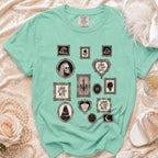Mint green t-shirt with framed gothic illustrations, including skulls, bats, and text.