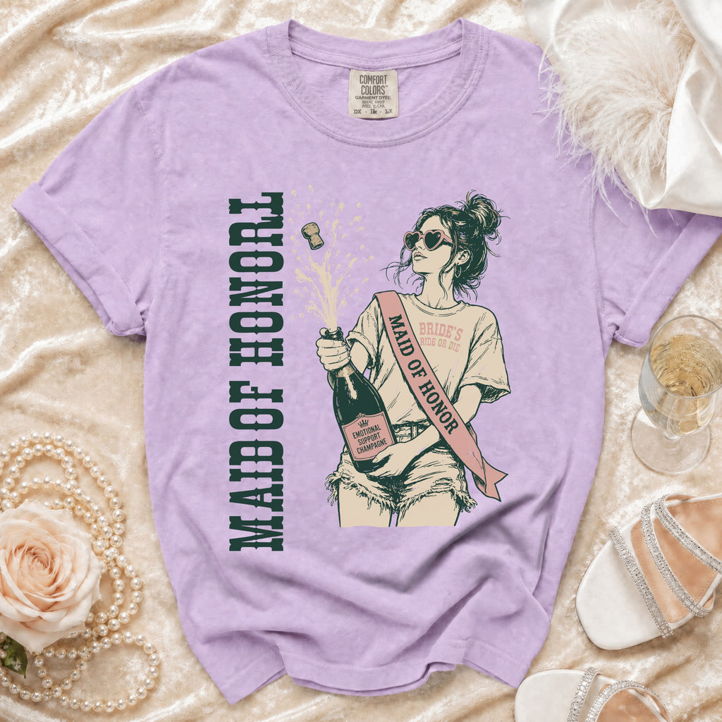 Purple t-shirt with a graphic of a woman popping champagne labeled "Maid of Honor".
