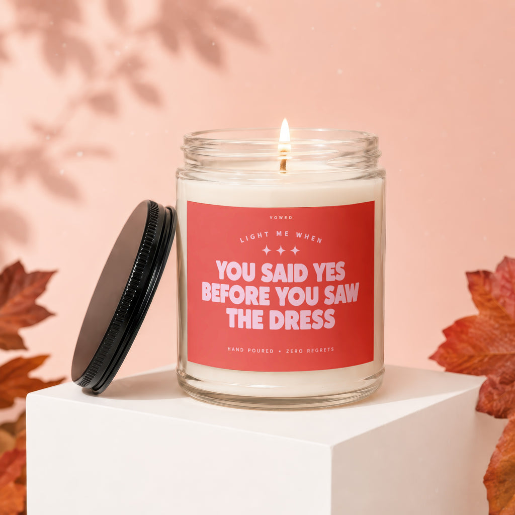 Candle with text "You Said Yes Before You Saw The Dress" and "Vowed".