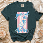 Green t-shirt with a goose holding flowers and text "goose of honor".