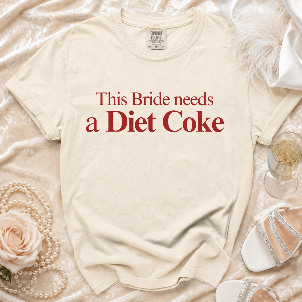 Cream t-shirt with red text reading "This Bride needs a Diet Coke".
