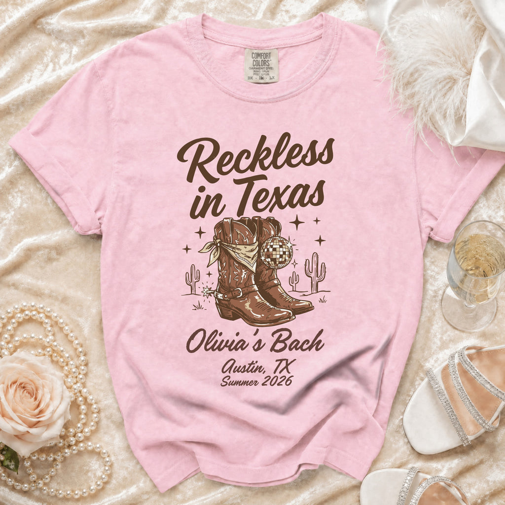 Pink t-shirt with "Reckless in Texas" and "Olivia's Bach Austin, TX Summer 2026".
