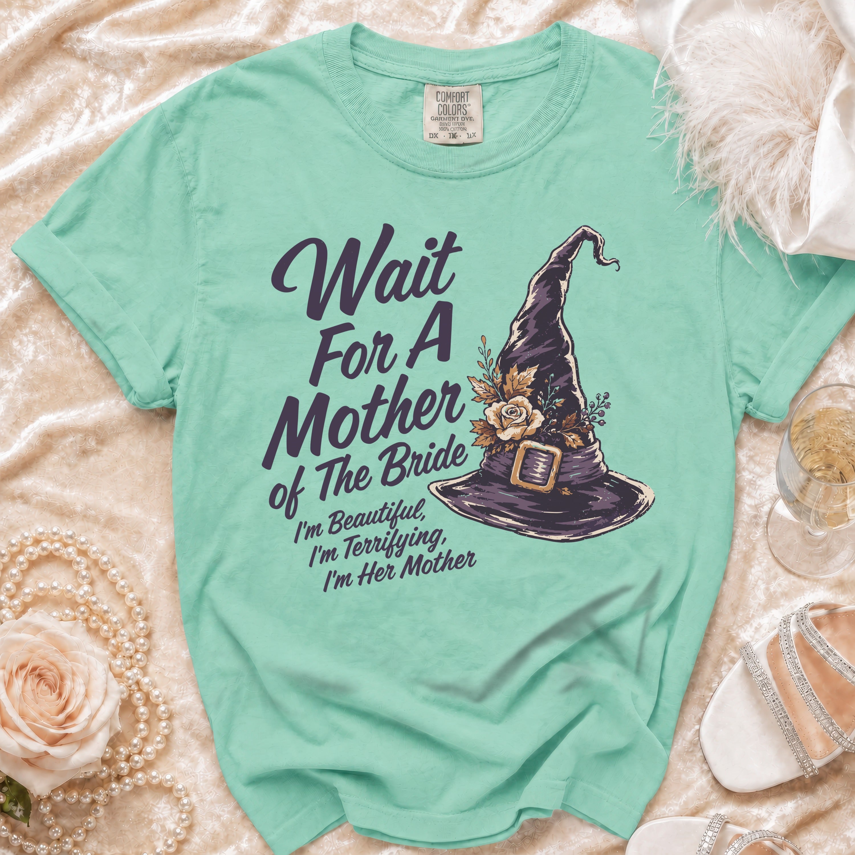 Teal t-shirt with witch hat graphic saying "Wait For A Mother of The Bride."